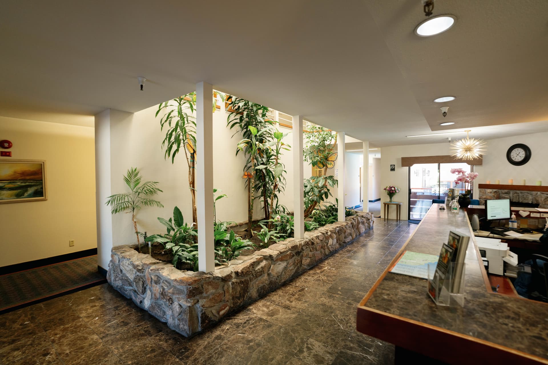 The welcoming lobby at Monarch Hotel with dedicated concierge desk