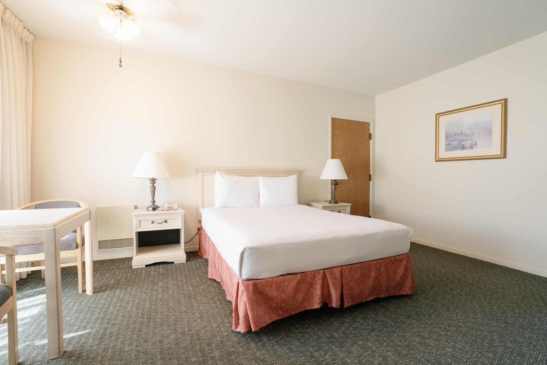 Queen guest room at Monarch Resort